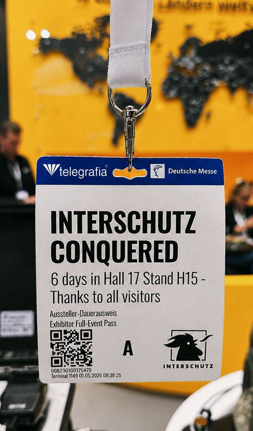 Credencial de expositor da Telegrafia na INTERSCHUTZ 2026 durante a principal feira internacional de proteção civil e segurança pública